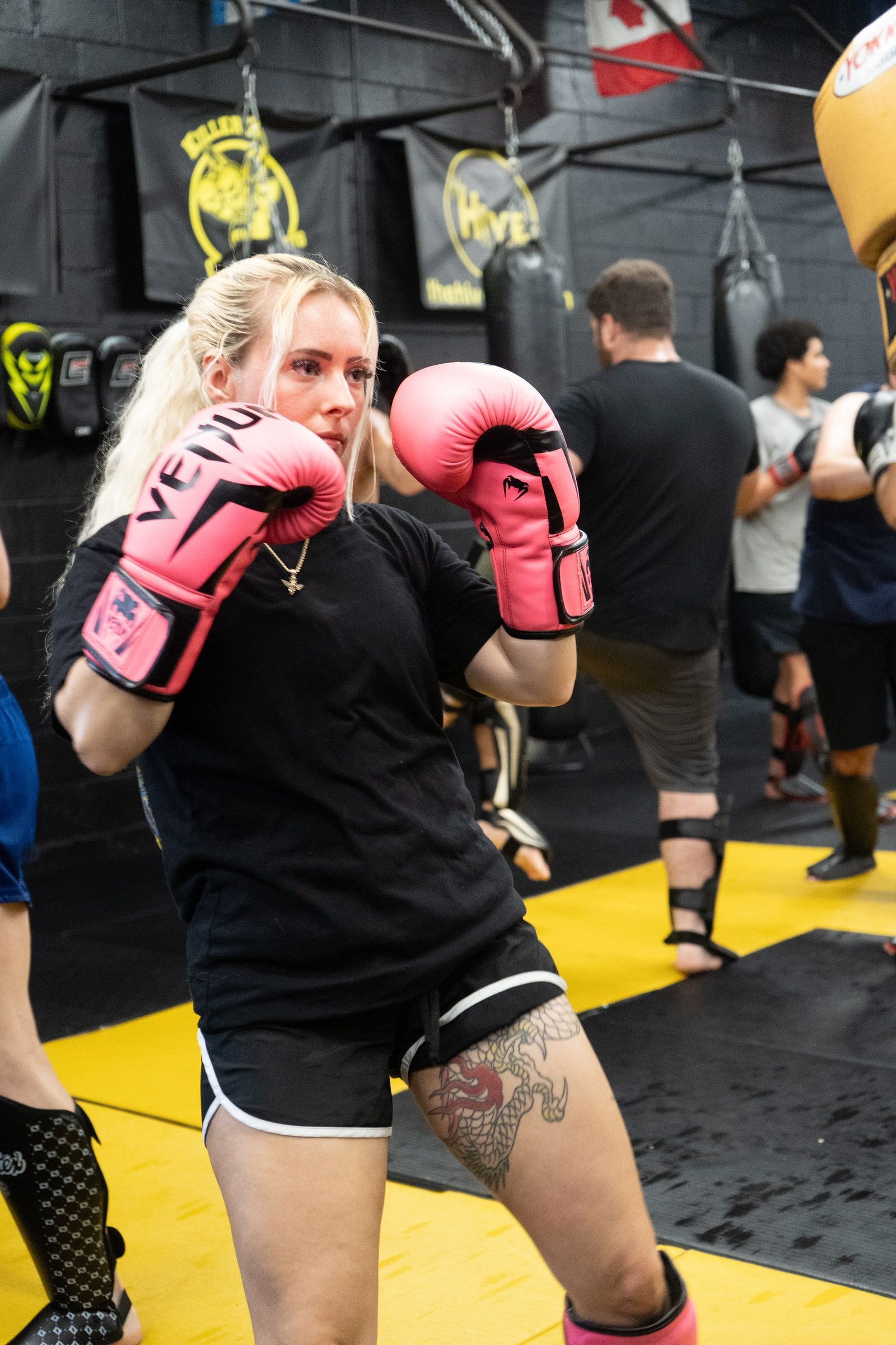 Students practicing combat training drills at Killer B Combat Academy.