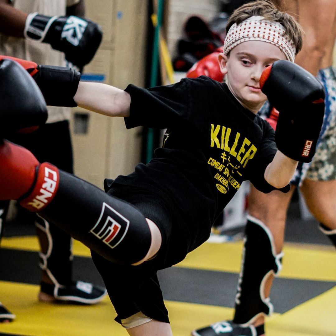 Students developing practical combat skills during martial arts training at Killer B Combat Academy.