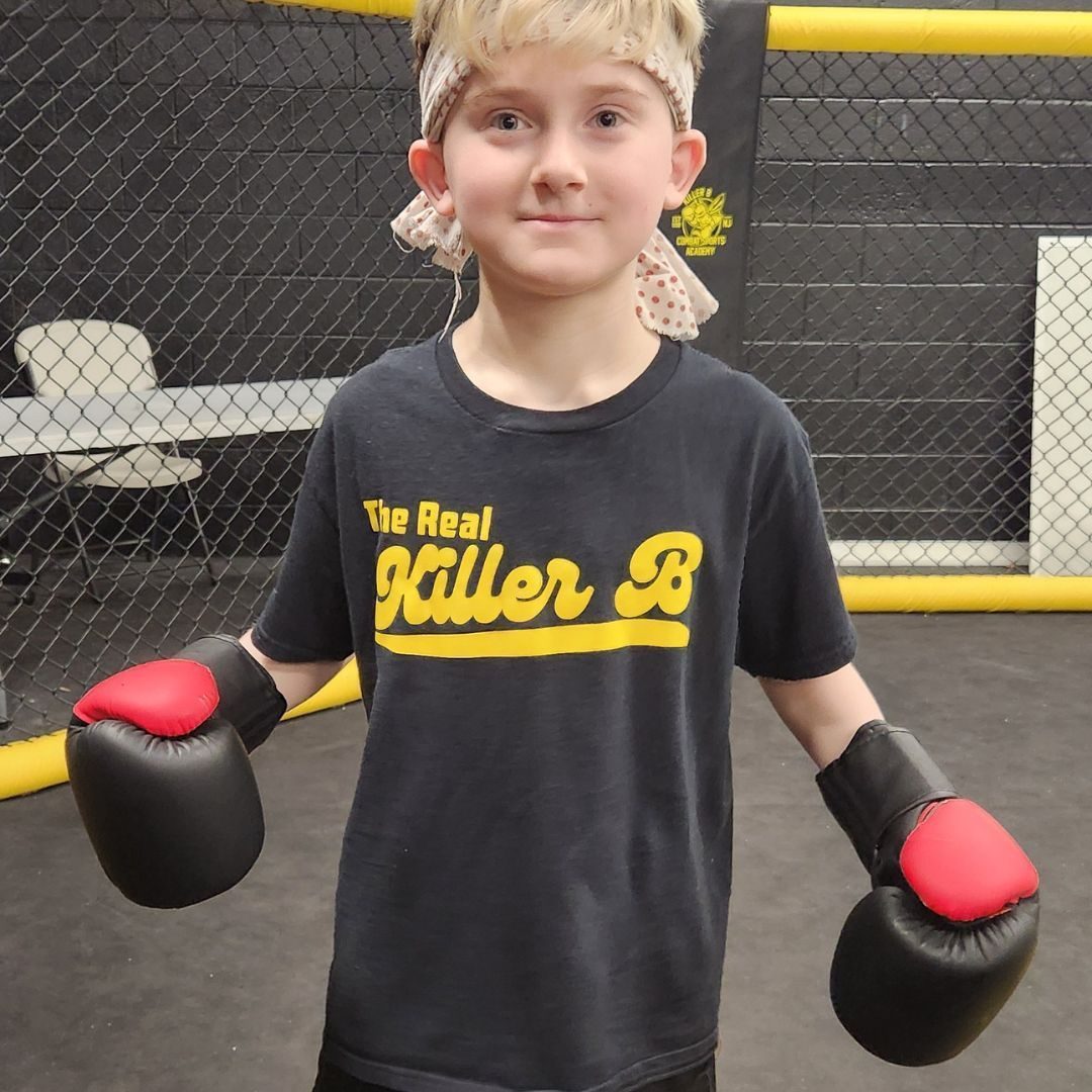 Students practicing martial arts techniques at Killer B Combat Academy.